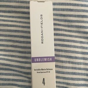 Rodan + Fields White and Purple Unblemish Invisible Matte Defense SPF 30